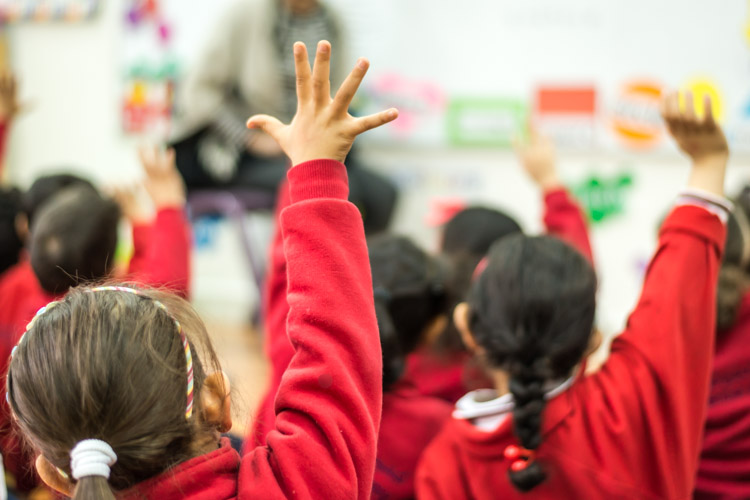 Gulf British Academy pupils raising hands